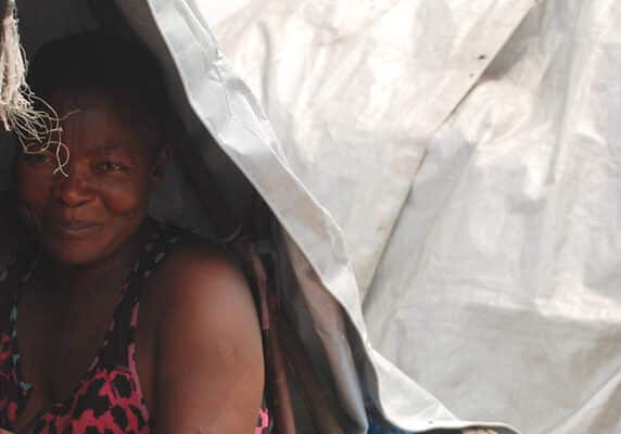 A woman in her shelter in Kanyaruchinya