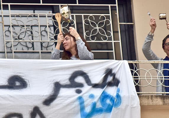 People in Lebanon share ABAAD’s hotline number from their balconies to encourage women experiencing domestic violence to seek help.