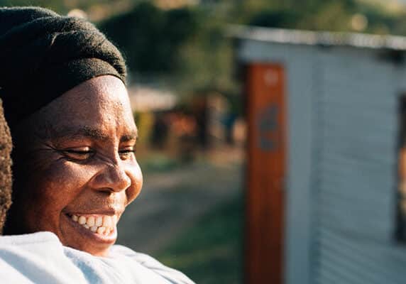 Two activists embrace in KwaMashu, an informal settlement north of Durban, South Africa. Christian Aid’s partner, Church Land Programme, works closely with the shackdweller movement (Abahlali baseMjondolo) so that people in KwaMashu can live without fear