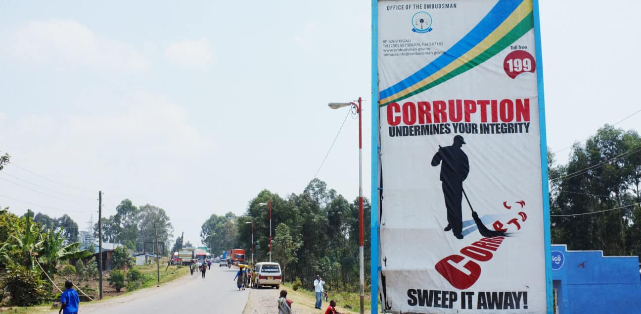 Corruption undermines your integrity - sweep it away! Road sign just before the Rwanda-Uganda border crossing.