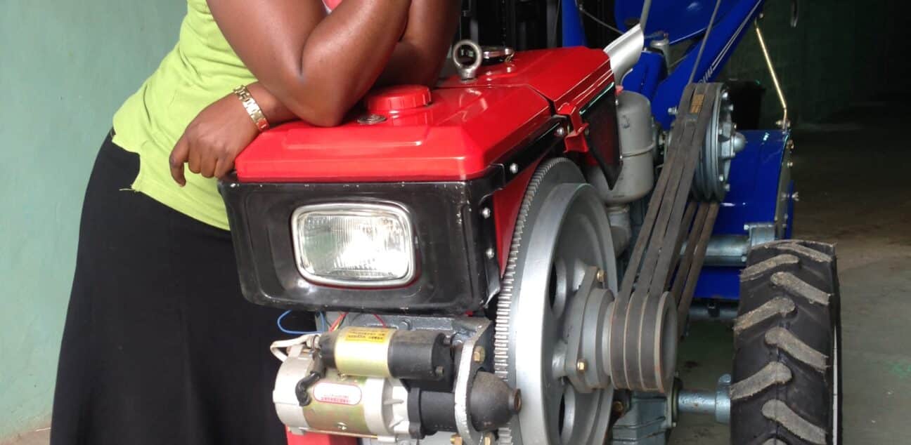 A woman in Nigeria with a Hello Tractor smart tractor