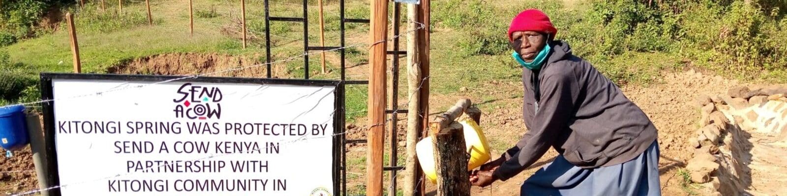 Collecting water at the Kitongi spring