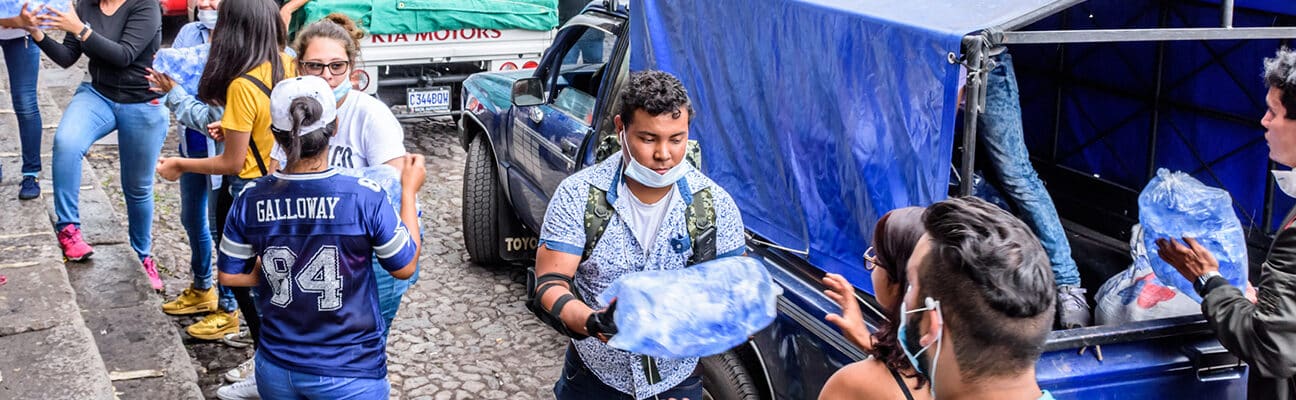 Volunteers load supplies outside town hall in Antigua, Guatemala to take to area affected by eruption of Fuego (fire) volcano