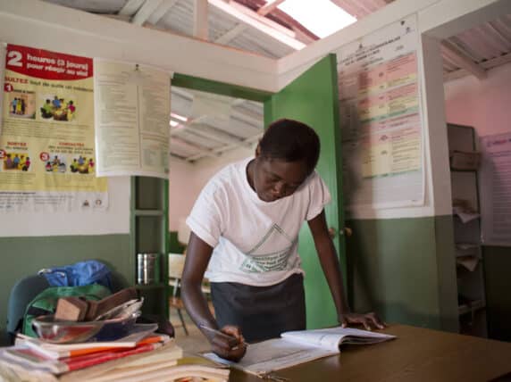 Woman in Haiti filling in form