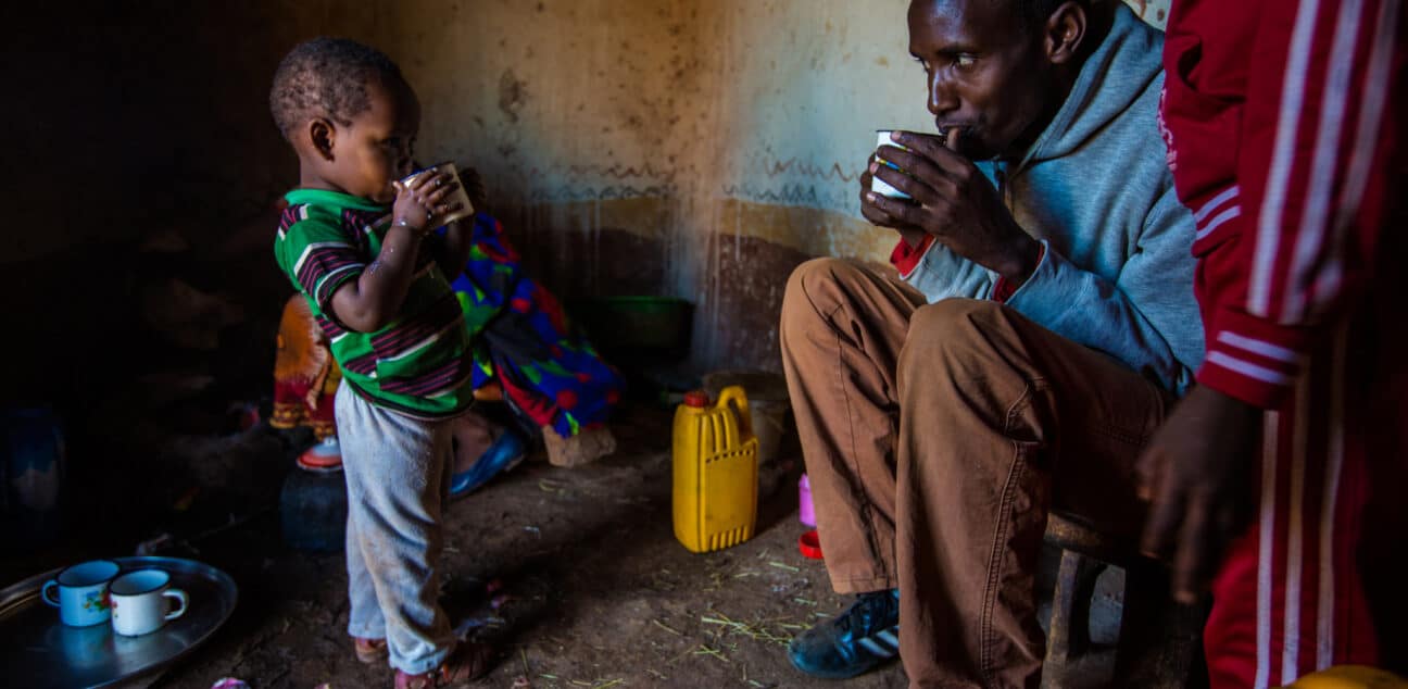 Man and child drinking tea