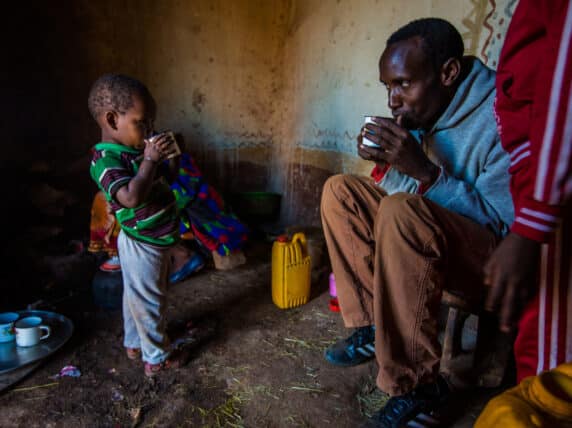 Man and child drinking tea