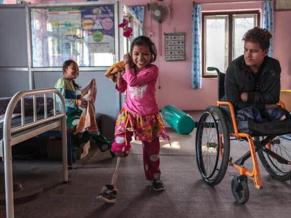 Nirmala practices walking with her new leg at the National Disabled Fund in Nepal