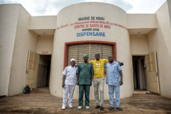 Dr Amadou stands with the rest of the surgical team outside the Nikki Health Centre