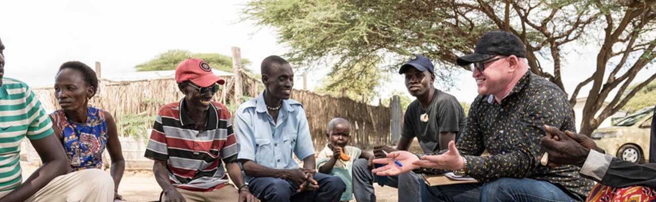 A meeting of participants in inclusive humanitarian project in response to drought in Turkana, Kenya, with CBM UK partner Kenya Red Cross Society. CBM UK/Eshuchi