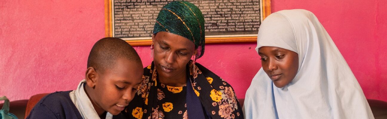 Safia Galgalo with her son Abudho and her niece Jilo check Abudho’s school work. Kenya spent $3.7 billion on external debt in 2023. If Kenya was able to invest its debt repayments into the education system, more children could be educated. Credit: PSAYS_PHOTOGRAPHY